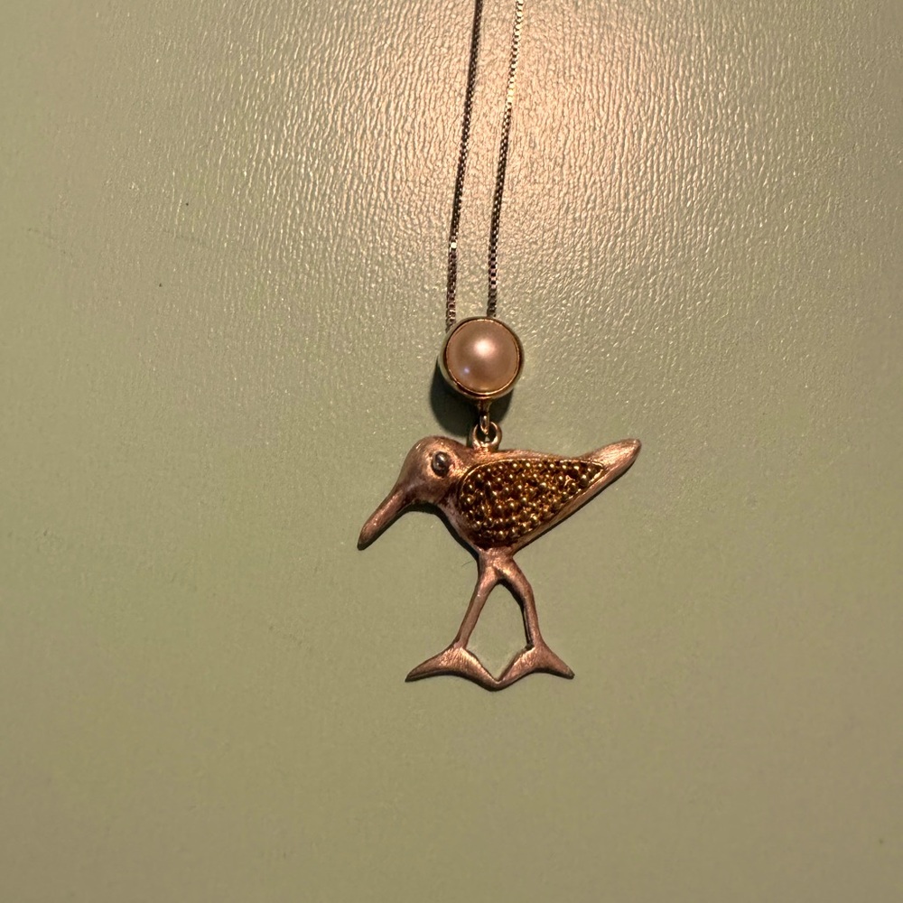 Silver bird and pearl necklace
